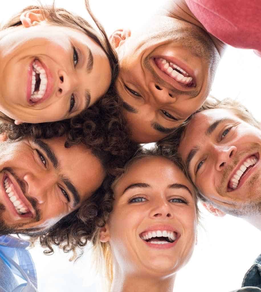 Smiling person showcasing white teeth after laser whitening treatment Kettering